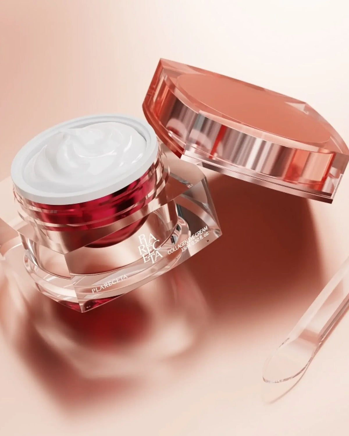 The Collagen Eye Cream open, with the applicator, on a rose ground.